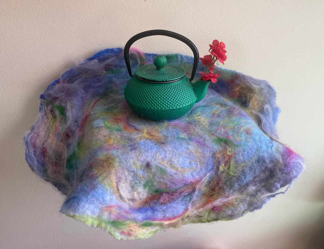 Teapot posing with felt